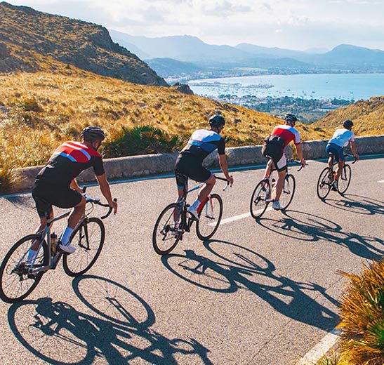 class-pic-1 cyclists riding down a mountain road